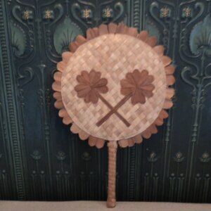 vintage wicker fan wall decor